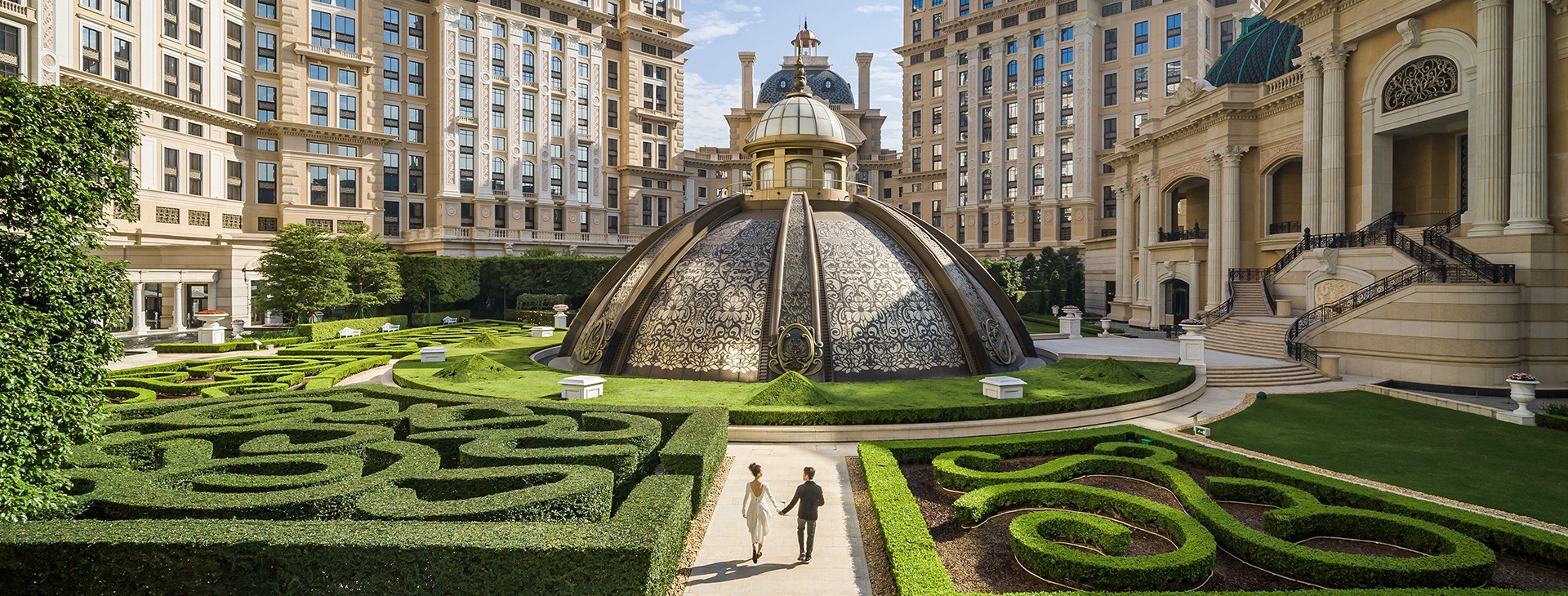/A%20pair%20of%20couples%20are%20walking%20in%20Jardim%20Secreto%2C%20the%20European-styled%20garden%20located%20at%20GLP%20Resort%20Macau.